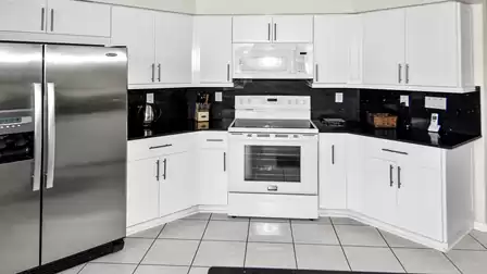 Modern kitchen with contrast in white, silver and black