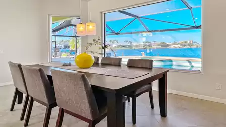 Dining area with big window view over the terrace