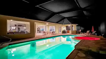 Illuminated pool and terrace spread a cozy evening atmosphere