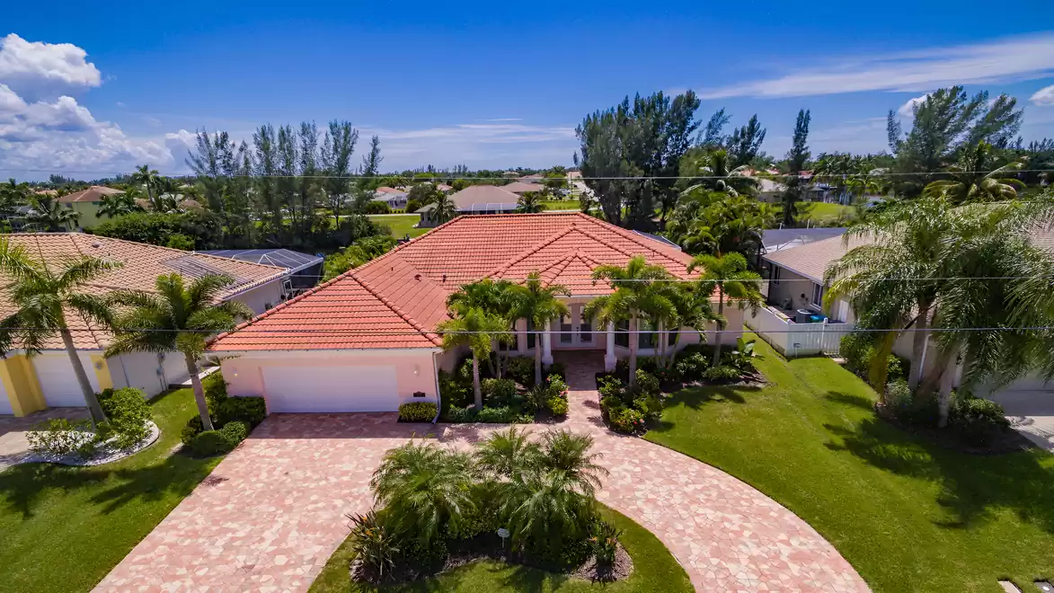 Villa Supremo offers an impressive circular driveway lined with palm trees