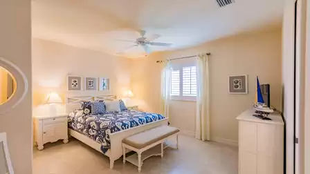 Beach-style furnishings are also featured in the fourth bedroom