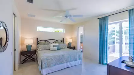 The second bedrooms, too, offers a King size bed and sliders to the pool area