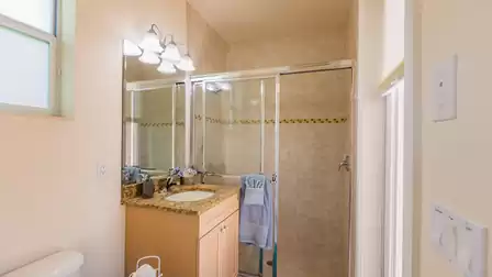 The third bathroom serves as pool bath