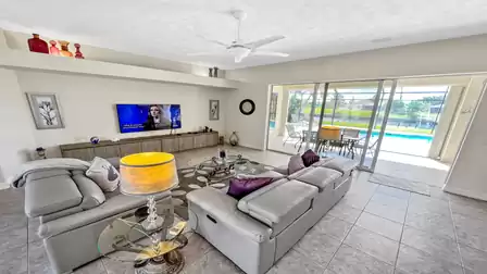 Living room with comfortable leather seating and flat screen TV