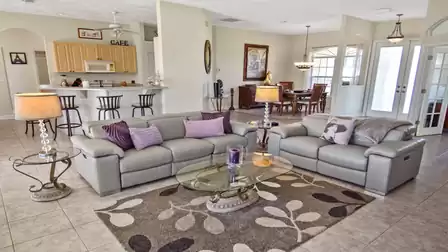 The open design combines living room, kitchen and dining room