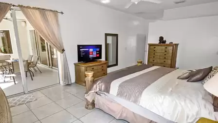Master bedroom with king bed and exit to the terrace