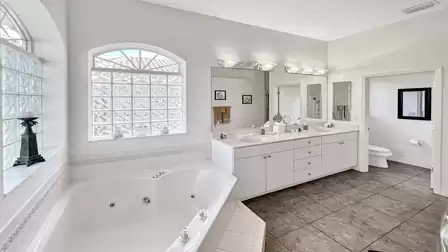 Look into the master bathroom with the big mirror