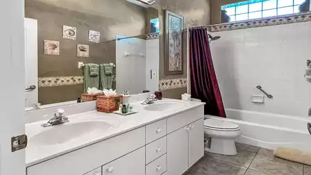 Bathroom between the two bedrooms with tub/shower and double sinks
