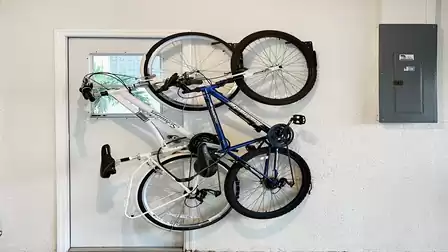 2 bicycles are in the garage for trips