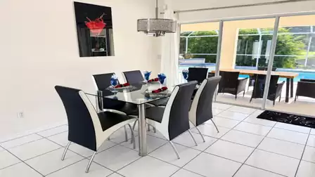 The dining room overlooks the attractive pool area