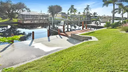 Canal-side terrace with dock and lift