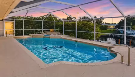 Villa Su Casa Cape Coral vacation rental pool with raised spa and canal view