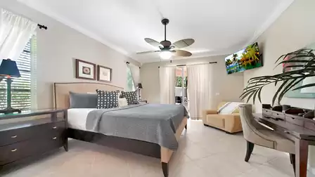 This beautiful bedroom offers a King size bed and access to the patio