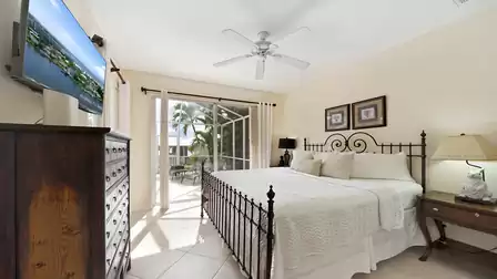 The second bedroom features another King size bed and leads out to the patio