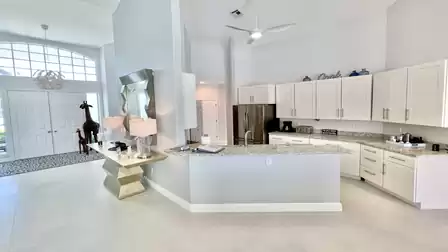 Fantastic, all-white kitchen with modern electrical appliances