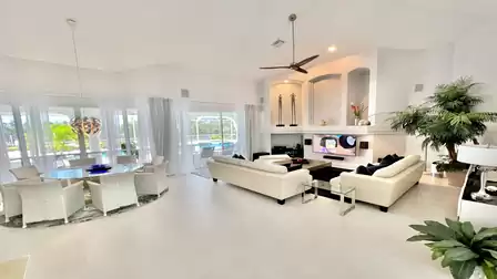 The spacious living/dining area is bright and flooded with light.