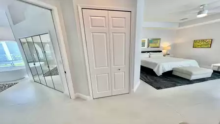 aster bedroom with view into the large bathroom