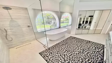 Modern freestanding bathtub and large walk-in glass shower