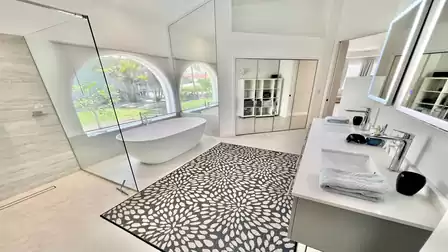 Bright and flooded with light, the bathroom presents itself in full size
