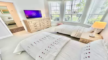 The third bedroom has two twin beds and, of course, a TV