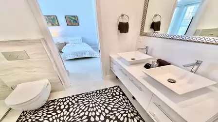 Like the others, the third bathroom features a double sink