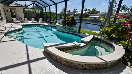 Crystal clear water in the electrically heated pool and spa invite you to relax