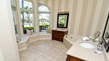 Exceptional layout in the on-suite bathroom with corner bath, shower, 2 separate washbasins and a relaxation area in front of the window