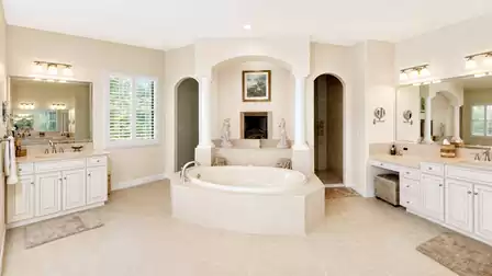 Master bath offers walk thru shower and separate garden style bath tub along with his and her sinks