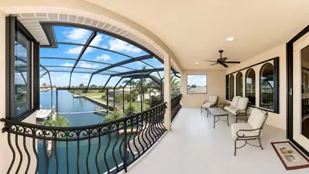 a balcony that offers plenty of room to sit down on one of the comfortable chairs and take in the beautiful view.
