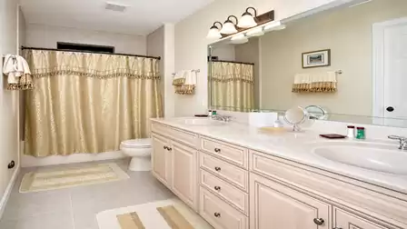 The third bathroom has a double washbasin and a shower tray