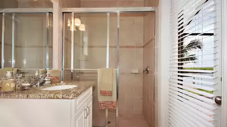 The pool bath features a shower