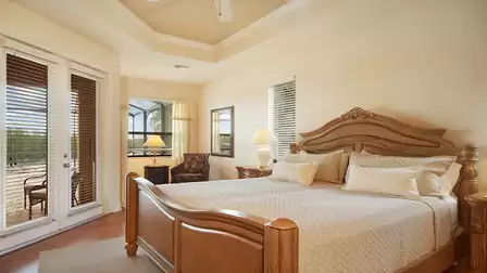 The elegant master bedroom features a King size bed