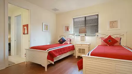 This bedroom with its nautical theme includes two Twin beds