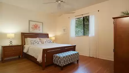 A Queen size bed can be found in the third bedroom