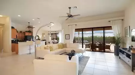 The open concept floorplan with living room, kitchen and dining area