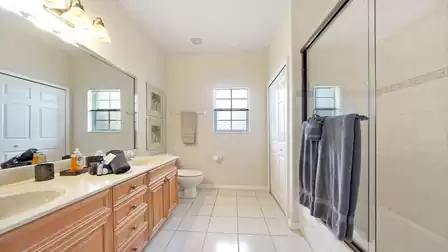 The guest bath offers a shower and double sinks