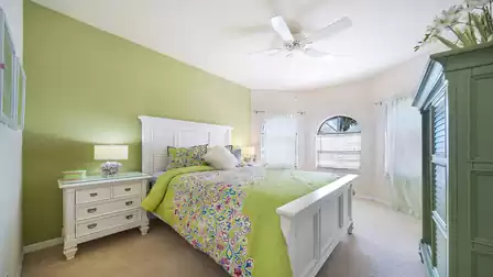 The cheerful front bedroom features a Queen size bed