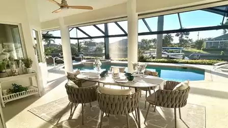 Modern chairs at the table under the covered terrace