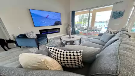 Inviting seating in the living room and large-screen TV
