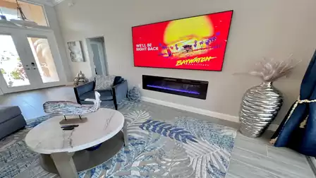 The living room is bright and flooded with light