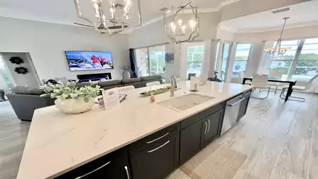 View from the kitchen into the living and dining area to the terrace