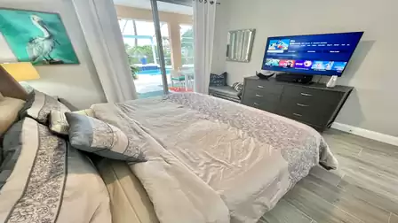 This bedrooms offers access to the pool area as well