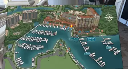 Illustrated marina and resort complex map showing labeled docks, kayak rentals and water taxi