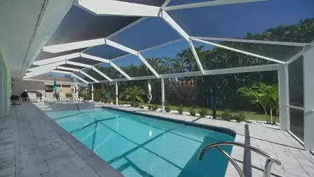 The pool area includes a sun deck