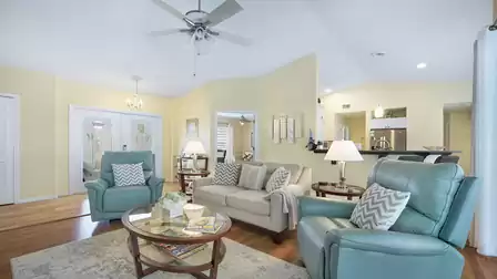 The living room offers beautiful wood floors and contemporary furnishings