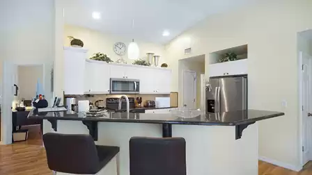 The black-and-white kitchen is fully equipped
