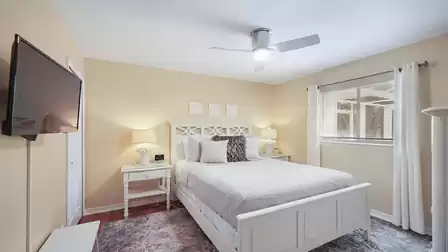 The second bedroom features a Queen size bed
