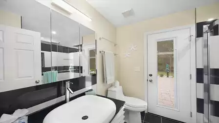 The guest bathroom serves as a pool bath
