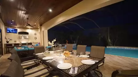 The dining area on the covered patio offers room for 8 guests