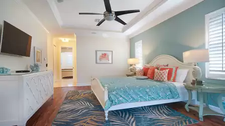 The master bedroom is a retreat of peace and relaxation, furnished with a spacious, oversized double bed that invites you to dream and linger